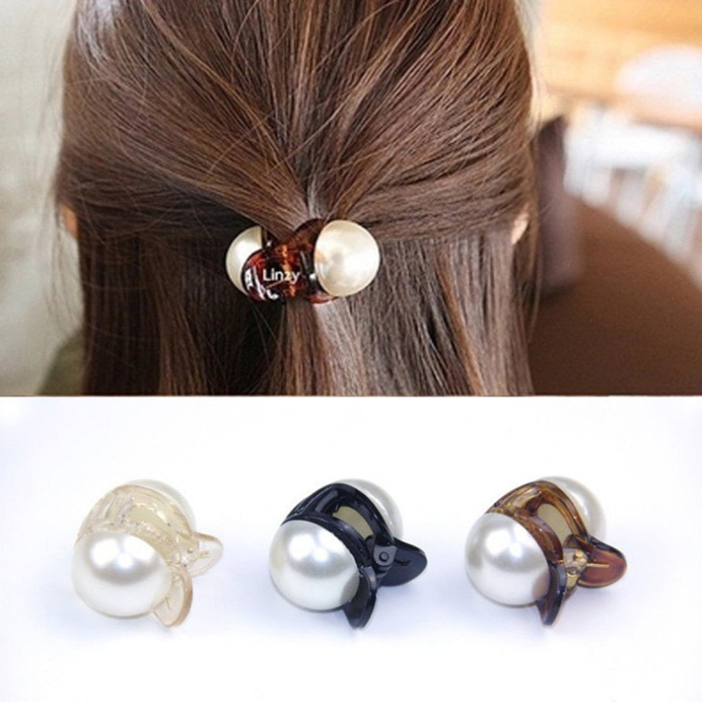 Woman styling hair with mini pearl hair claw clip in champagne color