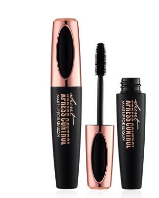Black mascara with a precision brush and gold accents