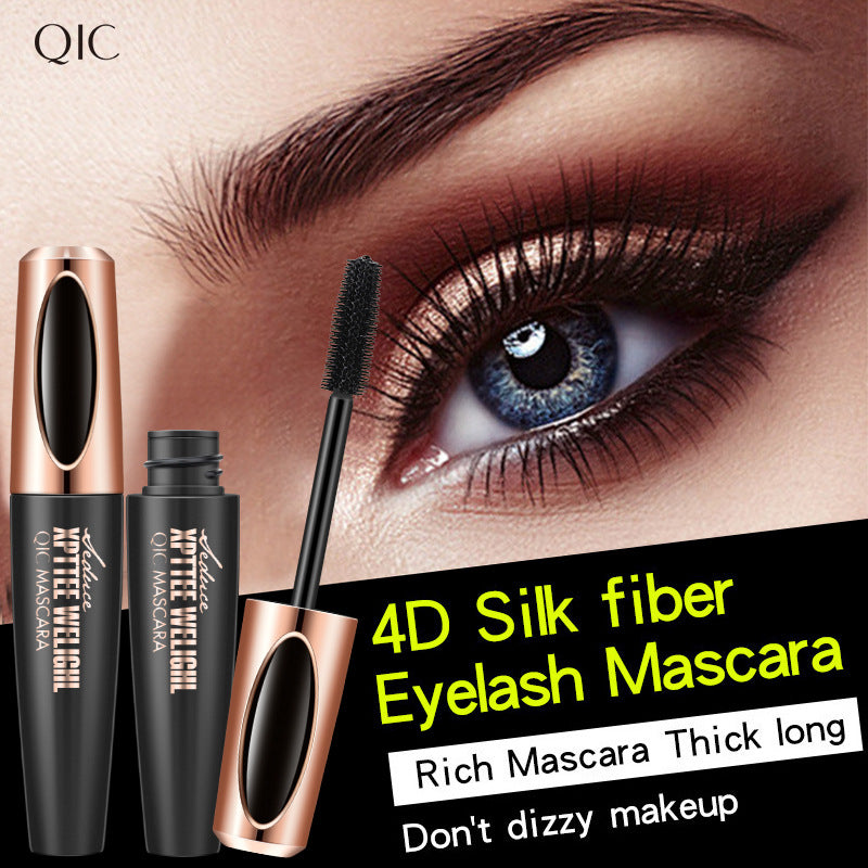 Black mascara with a precision brush and gold accents