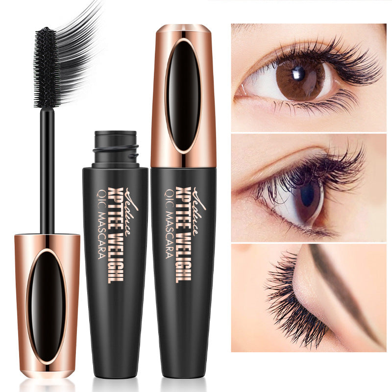 Black mascara with a precision brush and gold accents