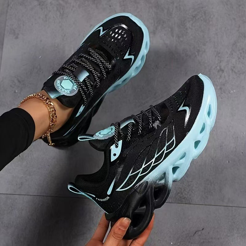 Pair of light blue breathable running shoes with lace-up closure