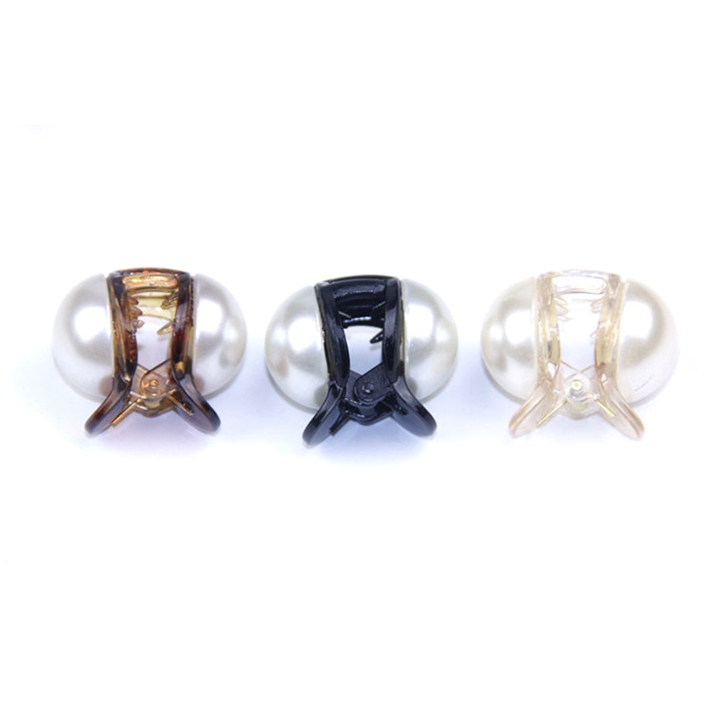 Woman styling hair with mini pearl hair claw clip in champagne color