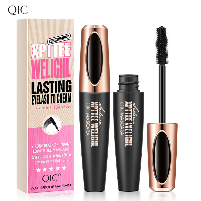 Black mascara with a precision brush and gold accents